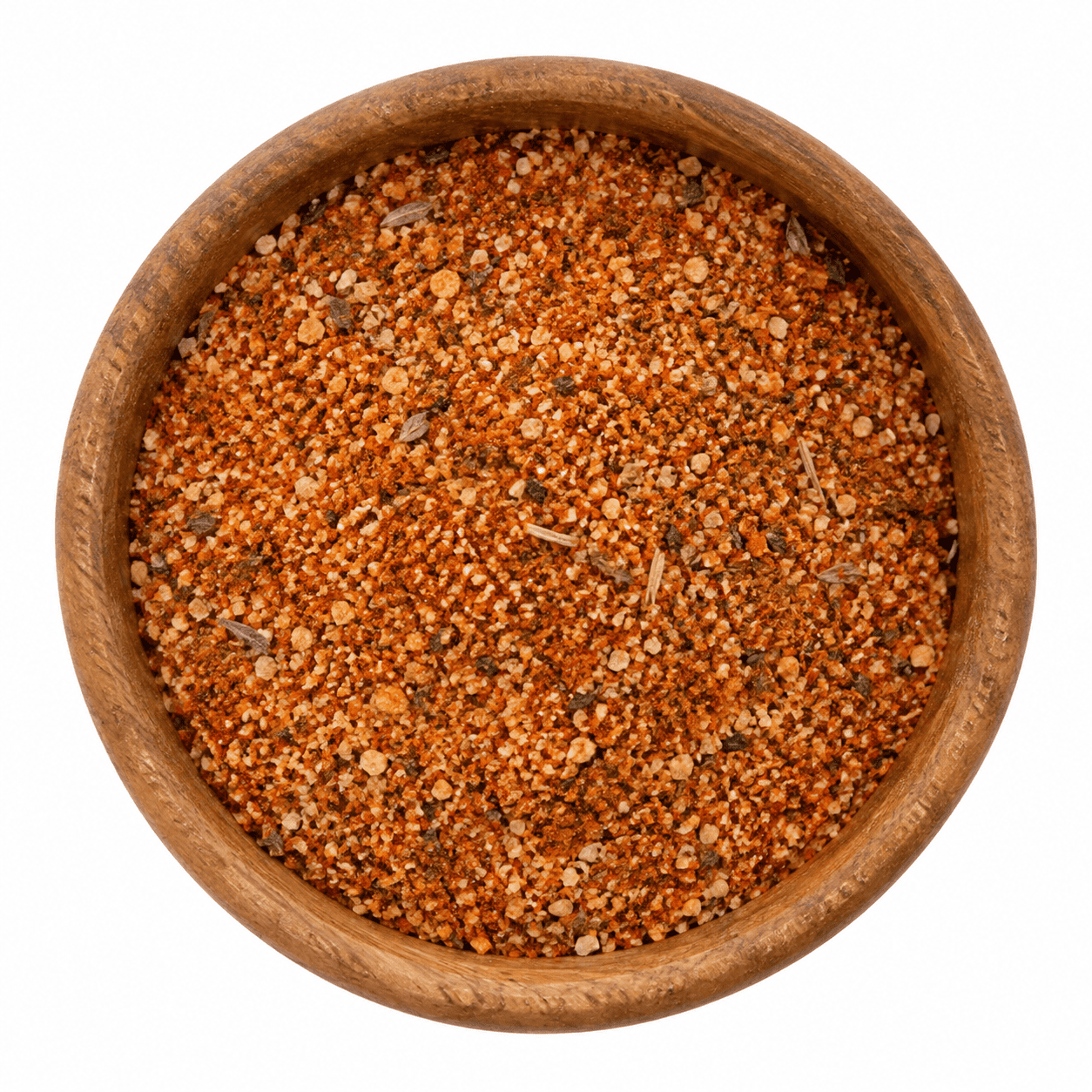 Cajun Creoolse kruidenmix in houten kom - Olie & Azijn Karavaan Cajun kruidenmix met zout in houten kom op witte achtergrond