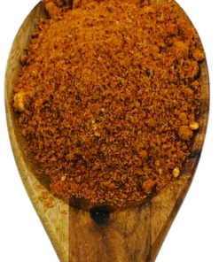 Rogan Josh currypoeder op een houten lepel