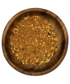 Grove Chakalaka kruidenmix met paprika en groenten in een houten kom